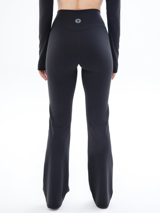 Close back shot of model wearing Ruay Muse Silhouet trousers