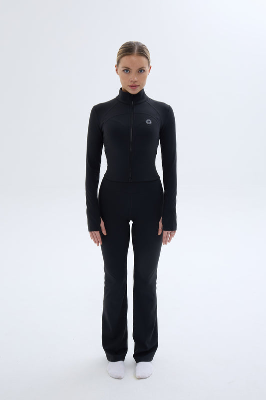 Front shot of model wearing Ruay Muse Silhouet jacket and trousers