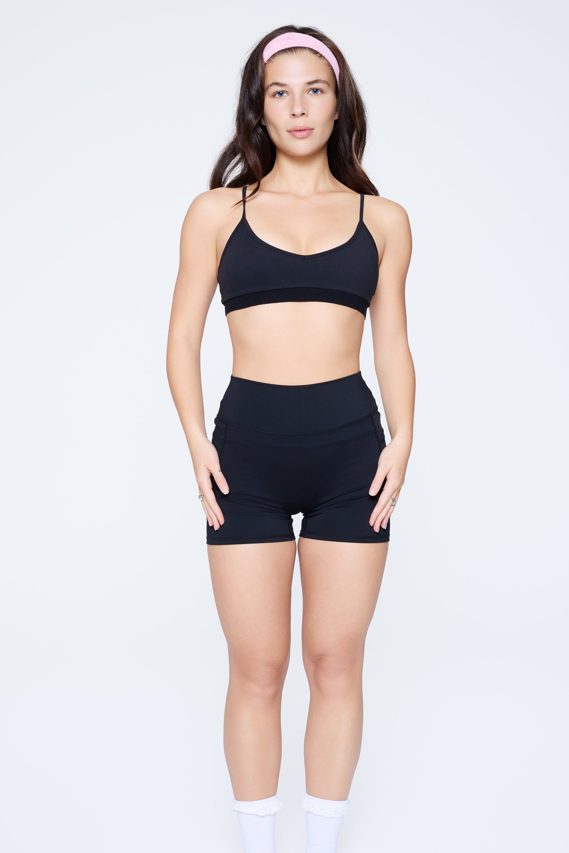 Front shot of model wearing Ruay Muse light form sports bra