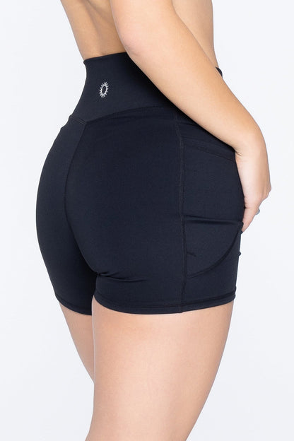 Side shot of model wearing Ruay Muse Drift shorts