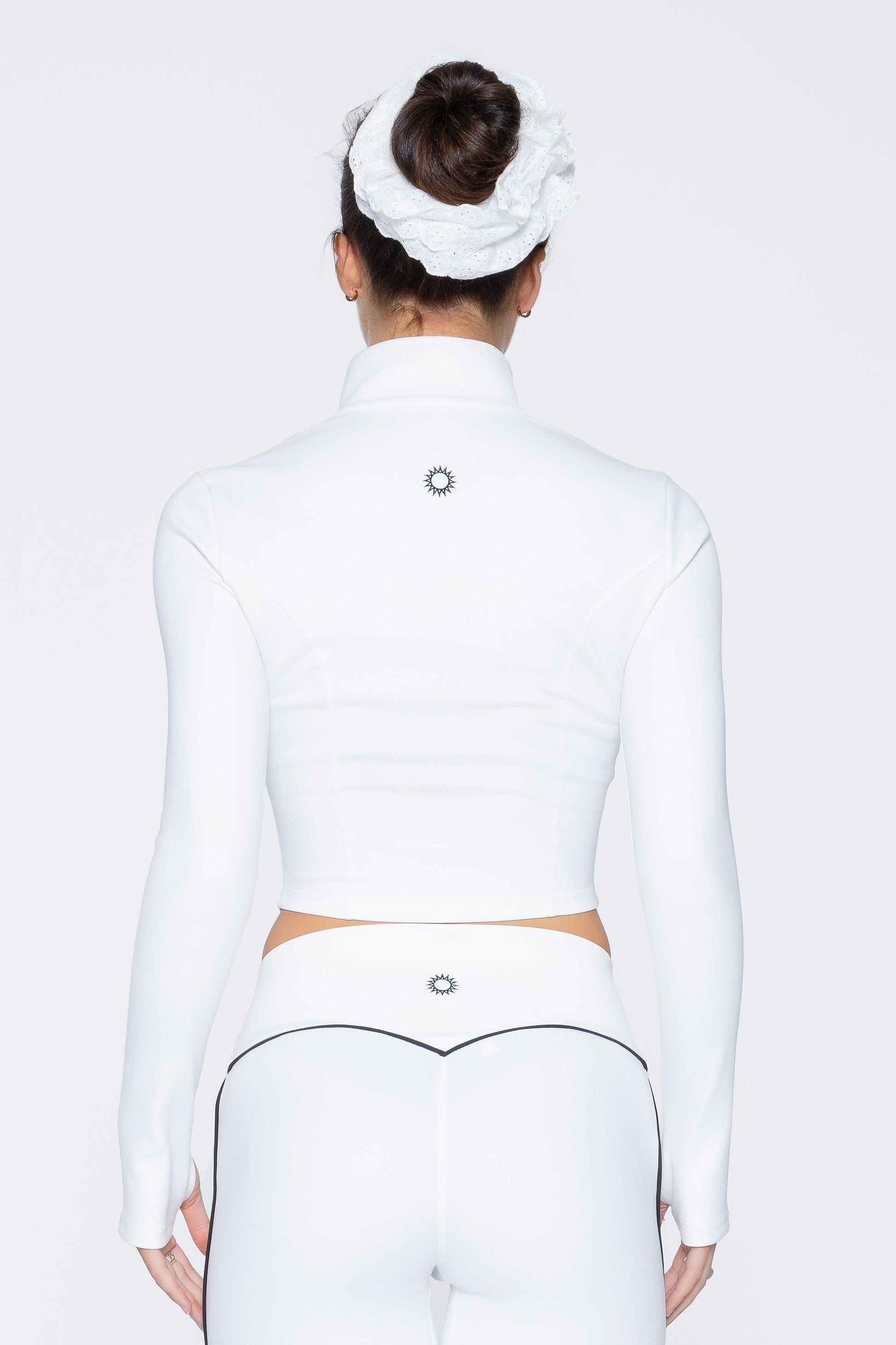 Back shot of model wearing Ruay Muse Axis jacket