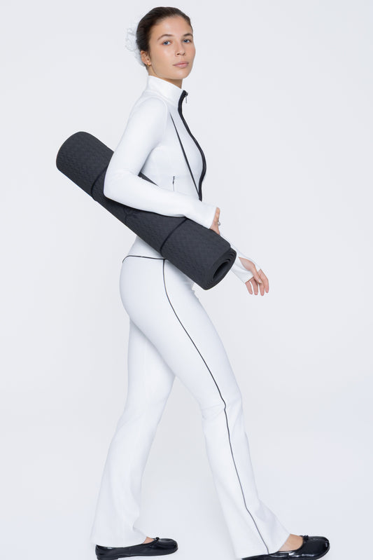 Side shot of model wearing Ruay Muse Axis jacket and trousers